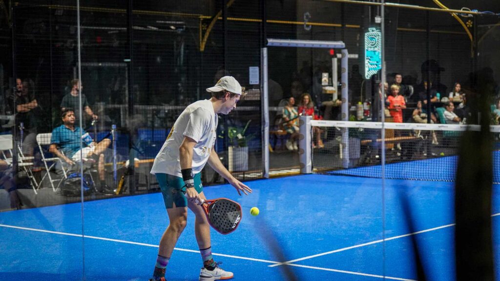 Padel players rallying indoors at Conquer Padel Tempe
